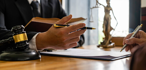 Attorneys or lawyers who are reading the statute of limitations Consultation between male lawyers...