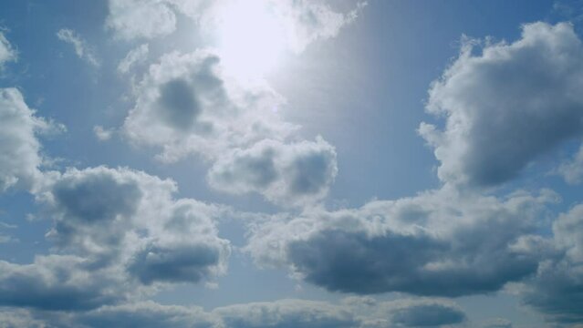 Fluffy curly rolling cloud in windy spring weather. White clouds background. Time lapse.