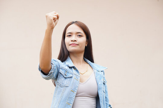 Asian Woman Holding Up Two Fingers