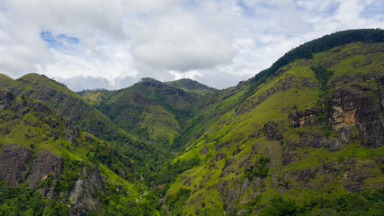 Aerial view of Mountains with rainforest and clouds. Sri Lanka.