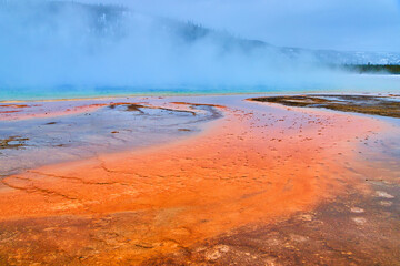 Stunning Grand Prismatic Spring in Yellowstone winter with lots of steam