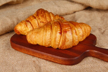 Crisp fresh croissants in the background