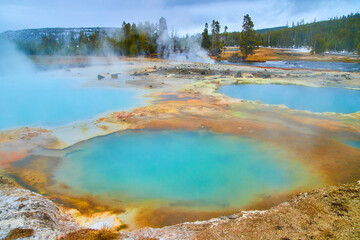 Stunning serios of Yellowstone pools of alkaline waters in winter