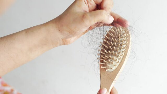 rear view of women hold his list hair close up 