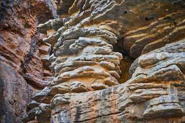 Layers in rocks of cliffs up close in detail