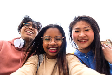 Selfie time. Happy multiracial gen z friends take picture of themselves.Teenagers having fun...