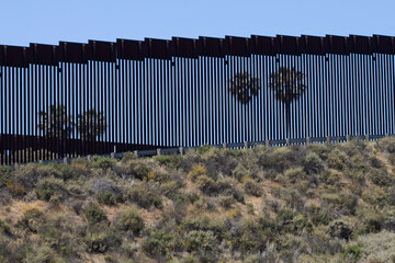 A double border wall between the United States and Mexico, separating San Diego and Tijuana, is...