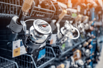 Close-up softfocus view of a reel from a professional fishing rod in a angling shop.