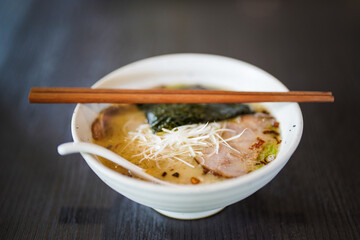 Ramen noodle with pork and chopsticks on the table