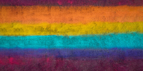 eine mit vielen bunten Farben bemalte Mauer wie ein Regenbogen als Hintergrund