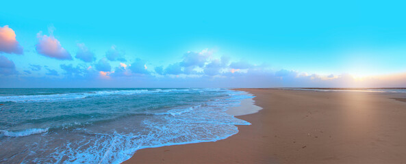 Beautiful landscape with turquoise sea with double sided sand beach  at sunset