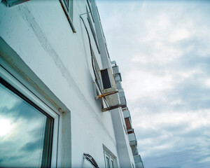 air conditioner mounted on building wall