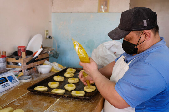 Latin American pastry chef preparing Mexican polvorones. Mexican Pastry. Mexican pastry chef.