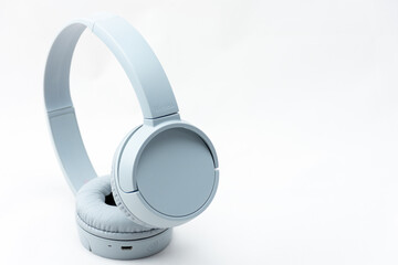 Close-up gray wireless headset on white background.	