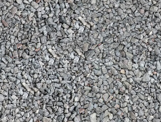 Seamless texture of the beautiful macadam. Gray, black, brown, beige, red stones are evenly...