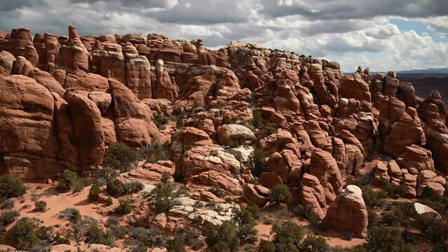 View of the Fiery Furnace at Arches National Park on a cloudy day, time lapse