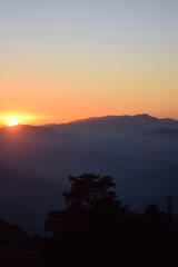 Fototapeta na wymiar The sun setting to the west, location - Kedarkantha, Uttarakhand, Shoot date - 21 Nov'21