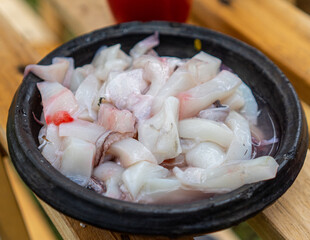 cut slices of squid in a bowl