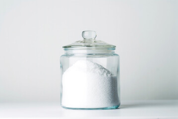 clear glass jar with white snow