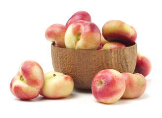 ripe flat peach on white background