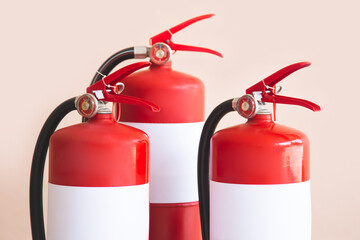 Close up fire extinguisher and firefighter checking pressure gauge level for protection and prevent...