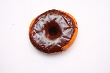 Chocolate Donuts laid on a white background