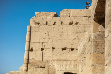 Different hieroglyphs on the walls and columns in the Karnak temple. Karnak temple is the largest...