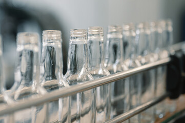 Row of glass bottles to fill with expensive alcohol drinks