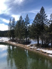 The view of Truckee river on a sunny winter day in North Lake Tahoe, California. Mountain river in Sierras. West coast vacation destinations. California roadtrip. 