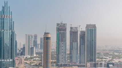 Fototapeta na wymiar Dubai downtown with fountains and modern futuristic architecture aerial timelapse