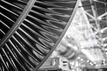 Shiny blades of high-speed steam turbine in workshop © nordroden