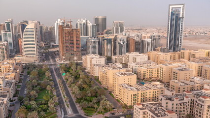 Skyscrapers in Barsha Heights district and low rise buildings in Greens district aerial timelapse. Dubai skyline