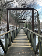 It is a bridge made of wood in winter