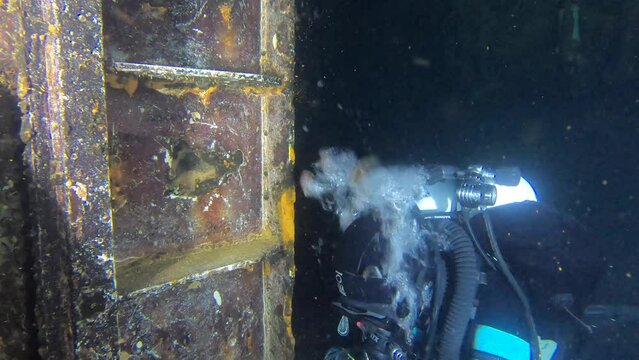 Scuba Divers Swims On The Shipwreck Swedish Ferry Zenobia. Wreck Diving in Larnaca, Cyprus.