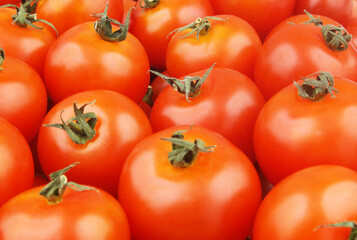 Ripe red tomatoes background or texture.	