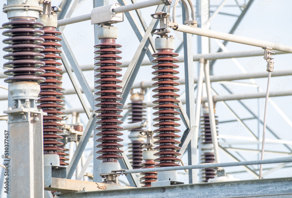 Wall mural many high voltage electrical insulators in power substation ,energy supply to the community