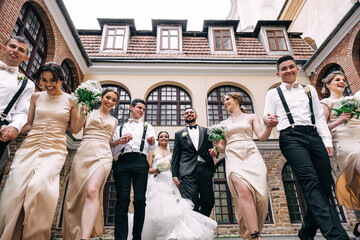 Joyful emotions of the bride and groom with friends