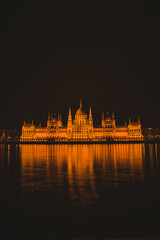 Fototapeta premium Hungarian parliament building from across the Danube river at night Budapest Hungary