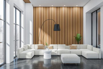 Light living room interior with sofa and coffee table, panoramic window