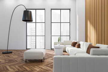 White lounge zone interior with sofa and coffee table, panoramic window