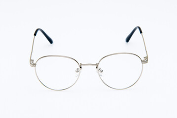 Fototapeta premium Fashion sunglasses silver frames on white background.