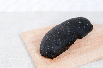 Fototapeta na wymiar Black Long John buns bread with copy space for text 