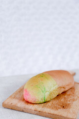 Rainbow Long John buns bread with copy space for text	
