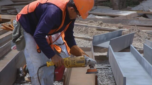 Construction worker using a polisher.
