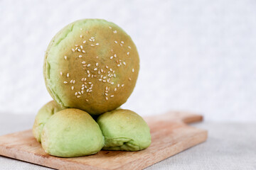 Green Pandan burger buns with sesame set with copy space for text	
