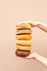 many different bagels in a stack