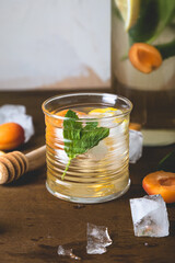 Homemade refreshing lemonade with fruits and ice
