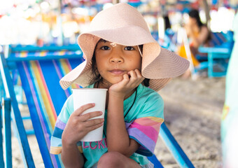 asian child girl happy on the beach