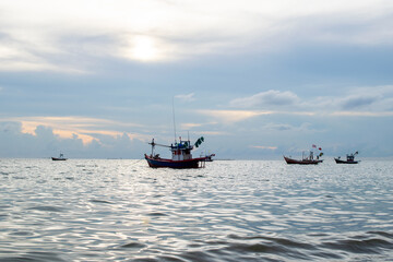 fishing boat on the sea with blue sky background