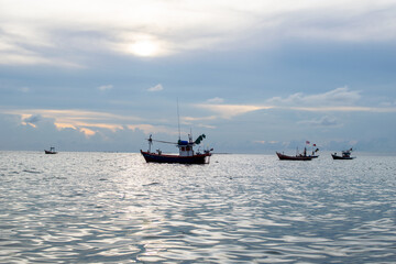 fishing boat on the sea with blue sky background
